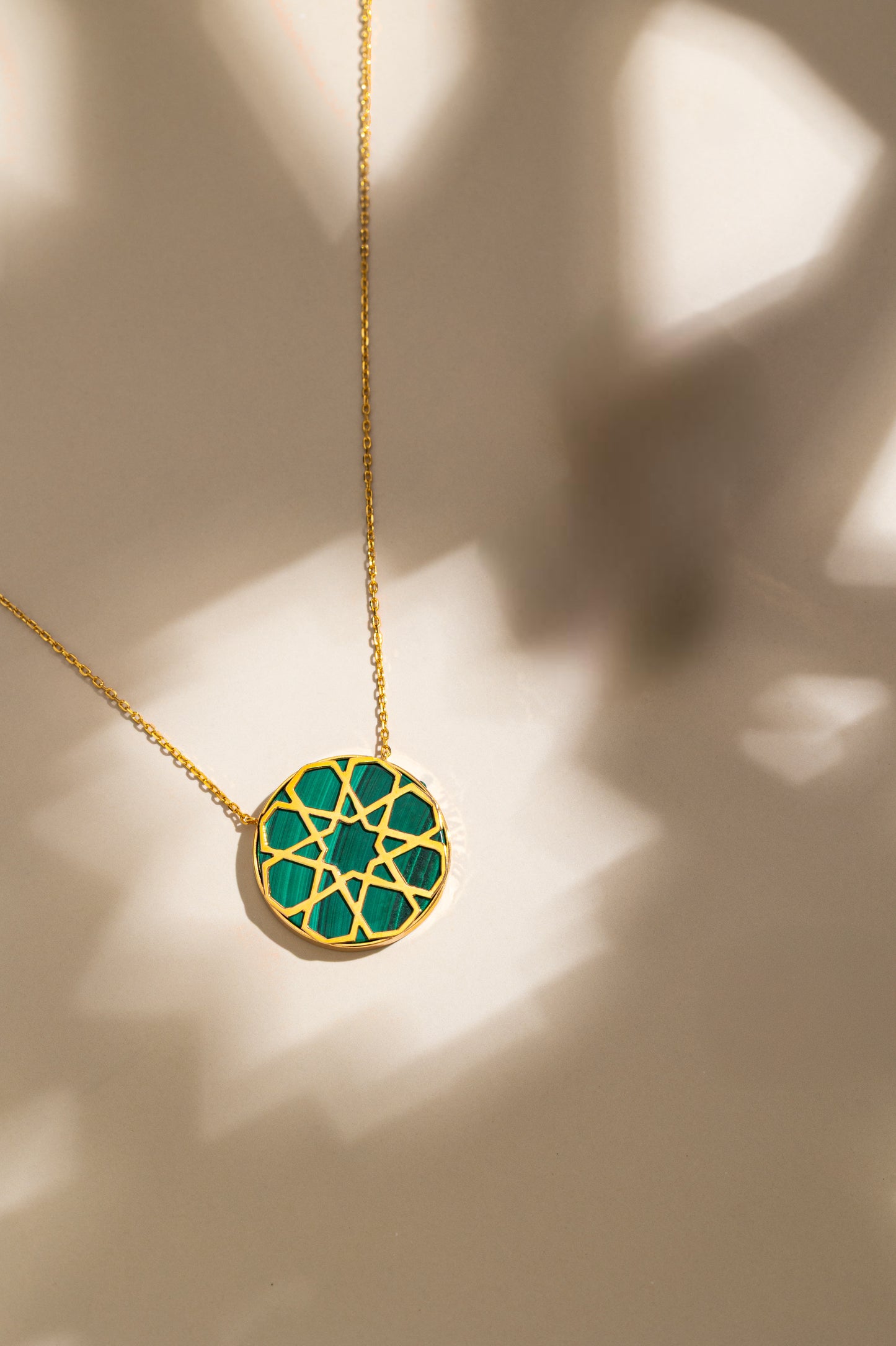 Arabie Necklace crafted in 18k yellow gold with natural green Malachite stone.
